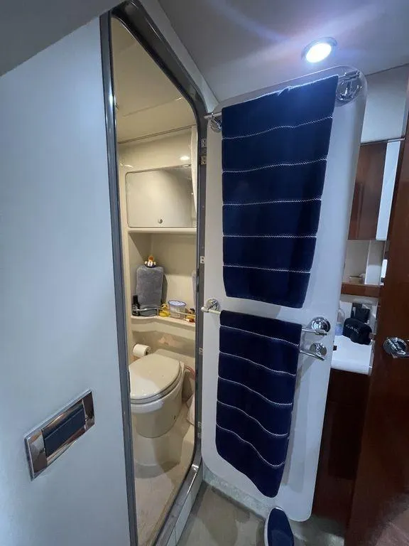 Slide: The Image of Bathroom interior of a 2009 Formula 45 Yacht with blue towels and modern fixtures. - 13