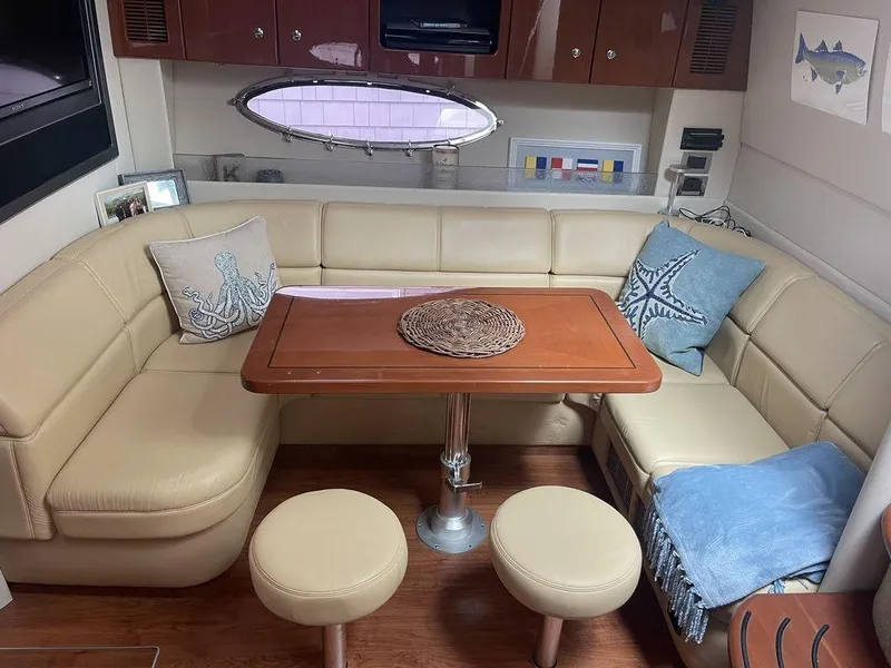Slide: The Image of 2009 Formula 45 Yacht interior with beige leather seating and wooden table. - 16