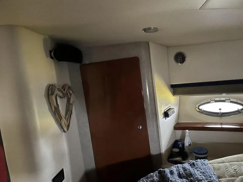 Slide: The Image of Interior cabin of a 2009 Formula 45 Yacht with wooden door and porthole. - 4