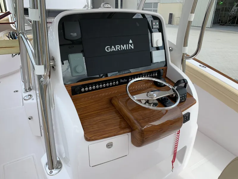 Slide: The Image of 2025 Mag Bay 33 CC boat helm with Garmin navigation system. - 9