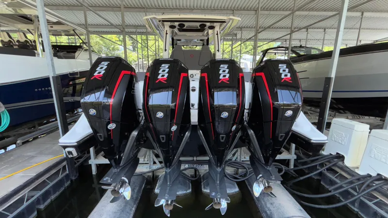 Slide: The Image of 2024 Fountain 43 SCX boat with four powerful 500R outboard engines in a marina. - 14