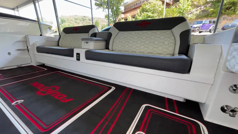 Slide: The Image of 2024 Fountain 43 SCX boat interior with stylish seating and branded floor mats. - 22