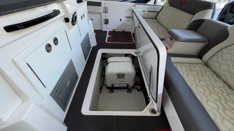 Slide: The Image of 2024 Fountain 43 SCX boat interior with open storage compartment and seating area. - 29