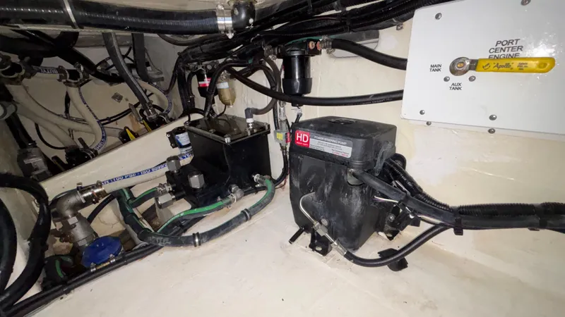 Slide: The Image of Engine compartment of 2024 Fountain 43 SCX boat, showing power steering pump and wiring. - 31