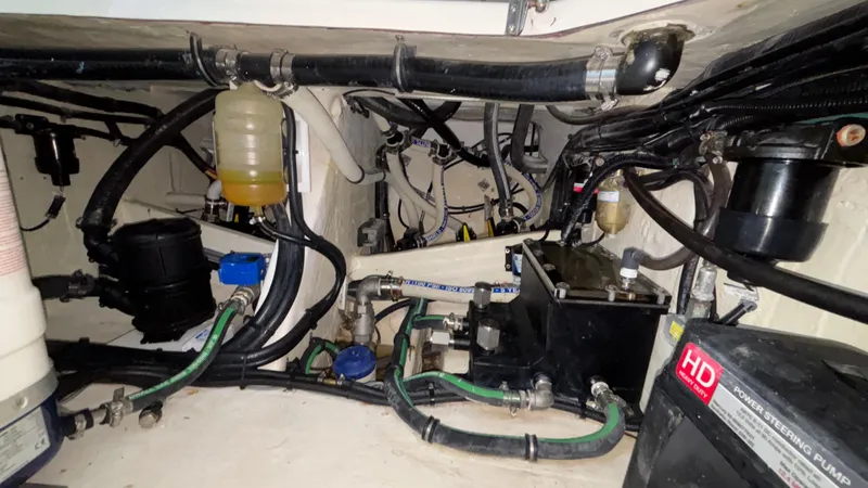 Slide: The Image of Engine compartment of 2024 Fountain 43 SCX boat, showcasing complex wiring and components. - 32