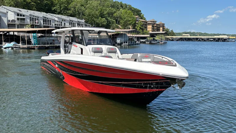 Slide: The Image of 2024 Fountain 43 SCX boat on a lake, featuring sleek red and black design. - 4