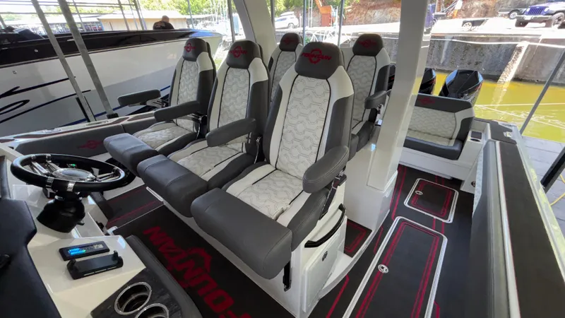 Slide: The Image of 2024 Fountain 43 SCX boat interior with luxury seating and modern steering console. - 45