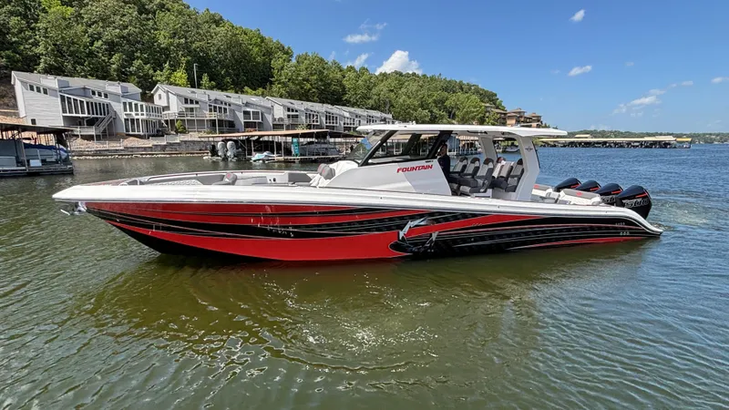 Slide: The Image of 2024 Fountain 43 SCX boat on a lake, with modern design and vibrant red accents. - 7