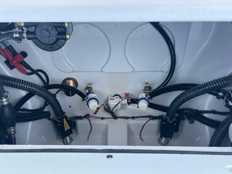 Slide: The Image of 2024 Sportsman 247 OE boat engine compartment with wiring and components. - 15