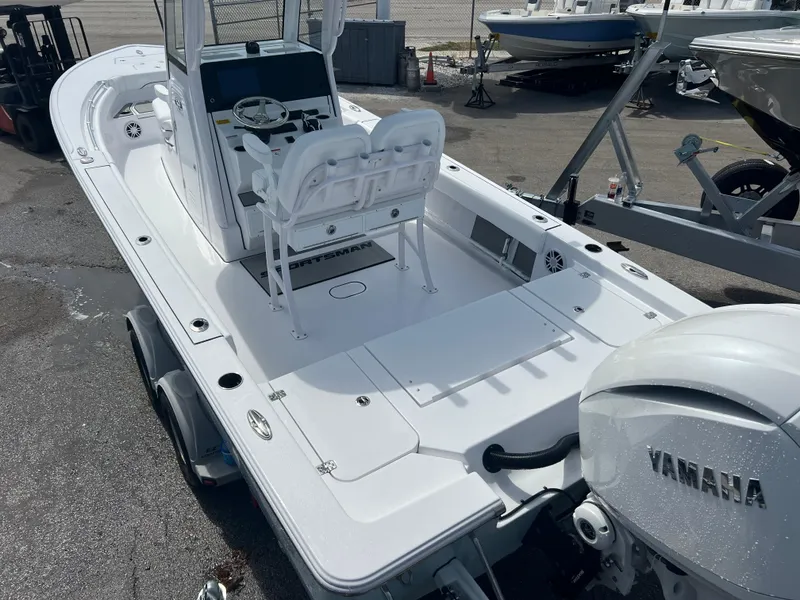 Slide: The Image of 2024 Sportsman 247 OE boat with Yamaha engine, docked on a trailer. - 16