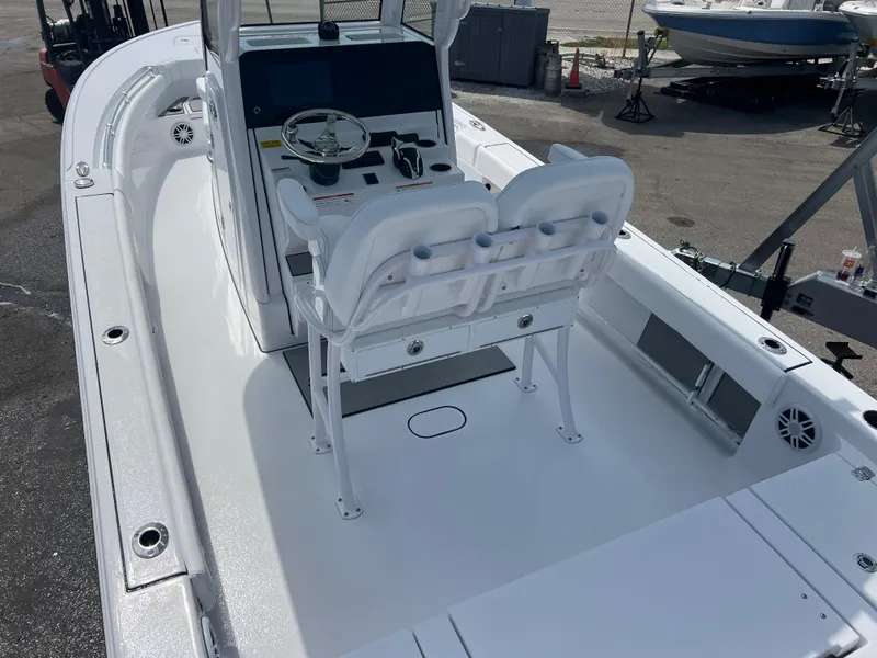 Slide: The Image of 2024 Sportsman 247 OE boat interior with dual helm seats and steering console. - 5