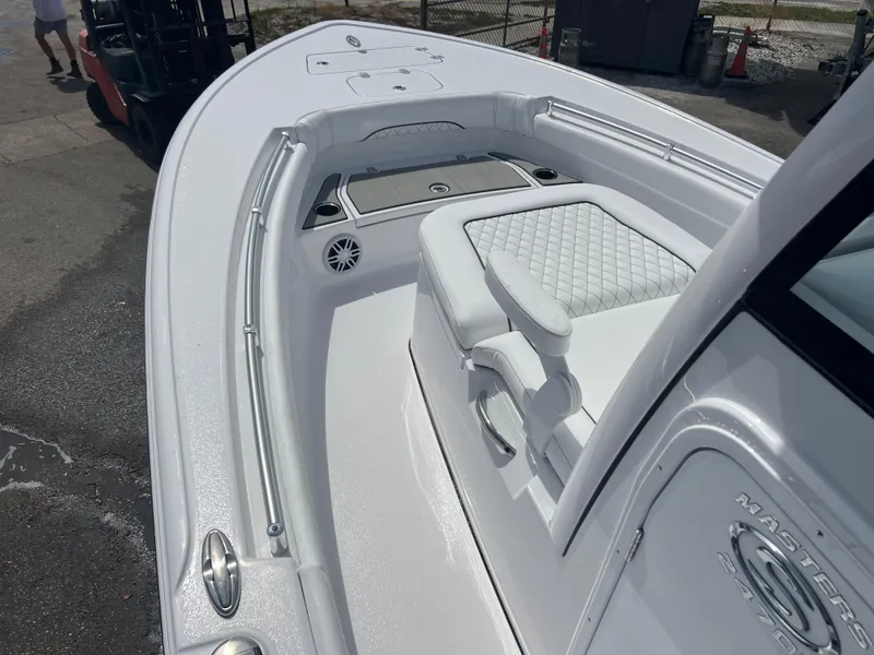 Slide: The Image of 2024 Sportsman 247 OE boat with white interior and seating. - 9