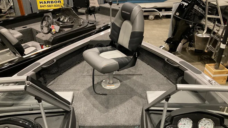 Slide: The Image of 2023 Crestliner 1750 Super Hawk boat interior with captain's chair and dashboard. - 2