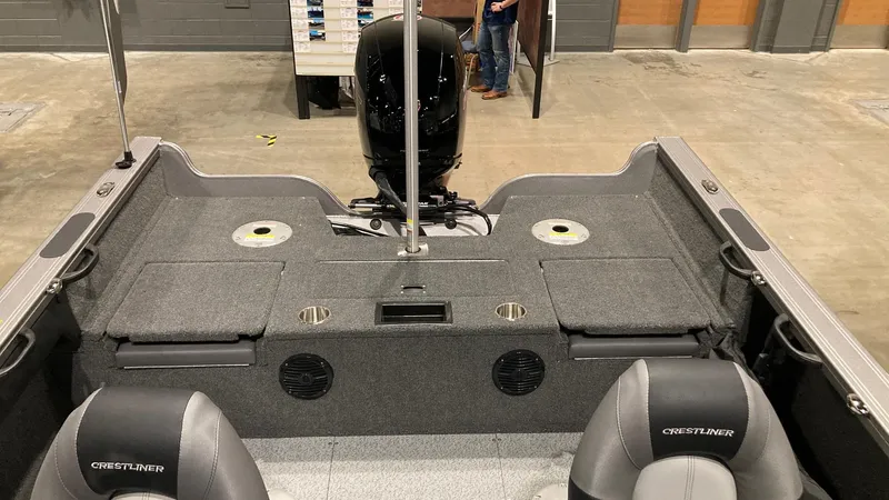 Slide: The Image of 2023 Crestliner 1750 Super Hawk boat interior with seating and storage compartments. - 3