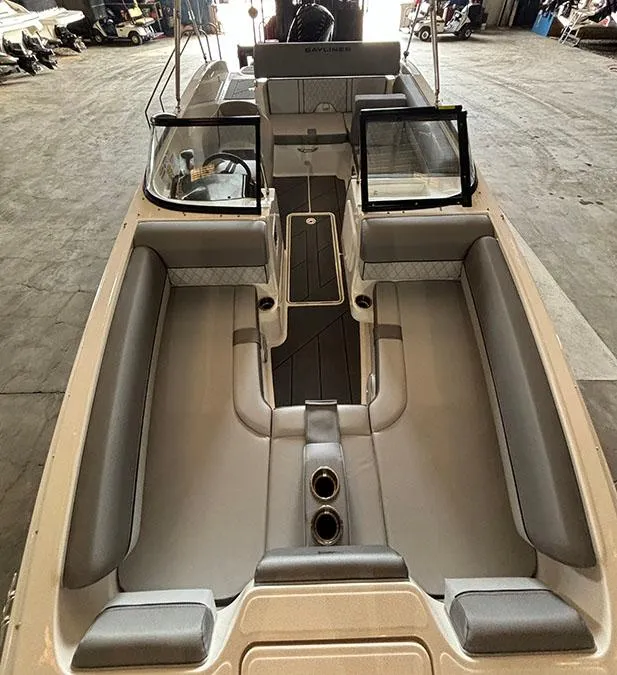 Slide: The Image of 2024 Bayliner DX2000 boat interior with spacious seating and modern design. - 11