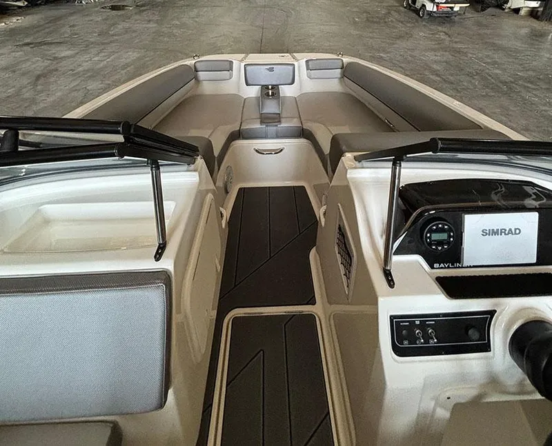 Slide: The Image of 2024 Bayliner DX2000 boat interior with Simrad navigation system and spacious seating. - 13