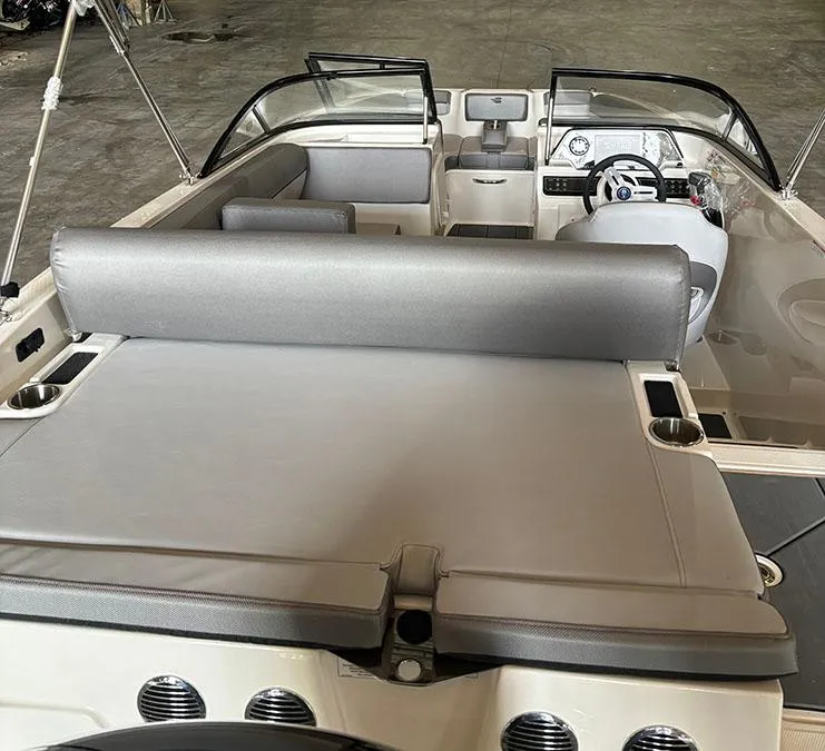 Slide: The Image of 2024 Bayliner DX2000 boat interior with seating and dashboard. - 3