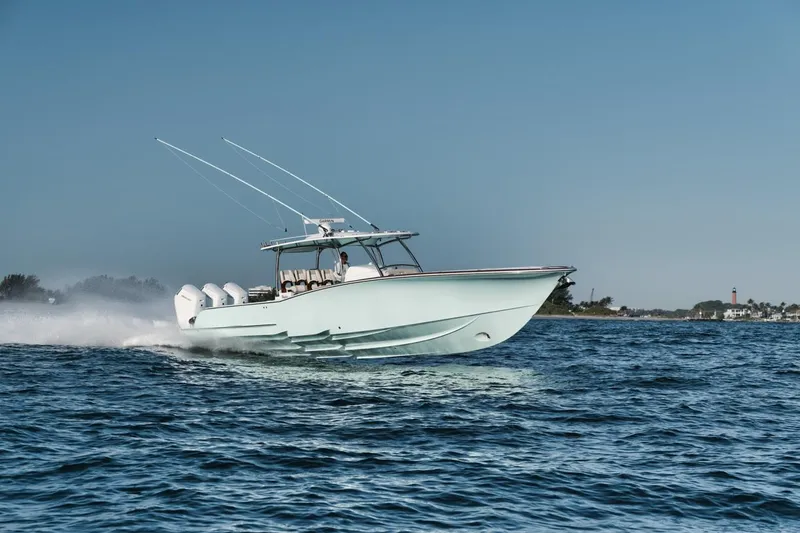 Slide: The Image of 2025 Mag Bay 43 CC boat cruising on open water. - 0