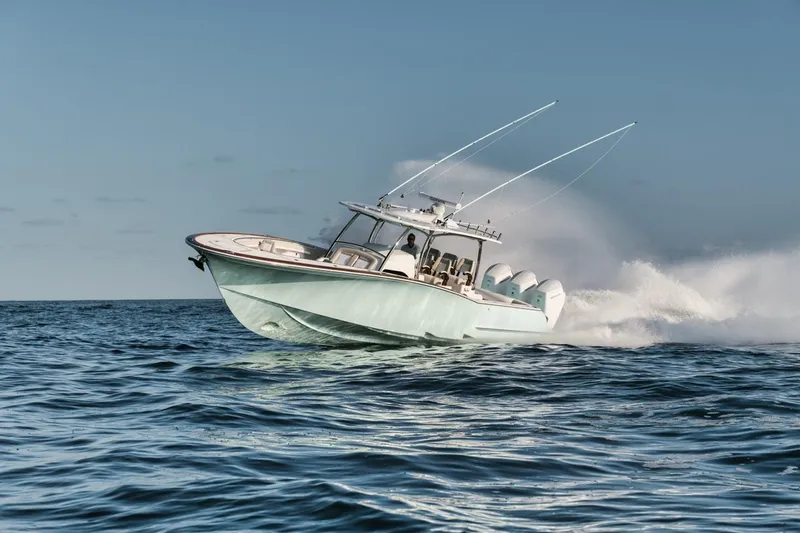 Slide: The Image of 2025 Mag Bay 43 CC boat speeding on open water. - 1