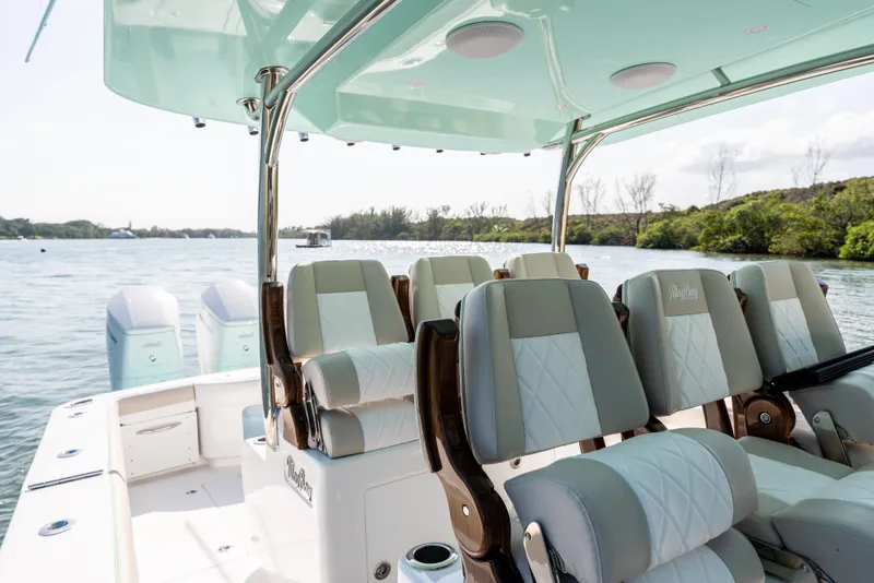 Slide: The Image of 2025 Mag Bay 43 CC boat interior with luxurious seating and scenic water view. - 10