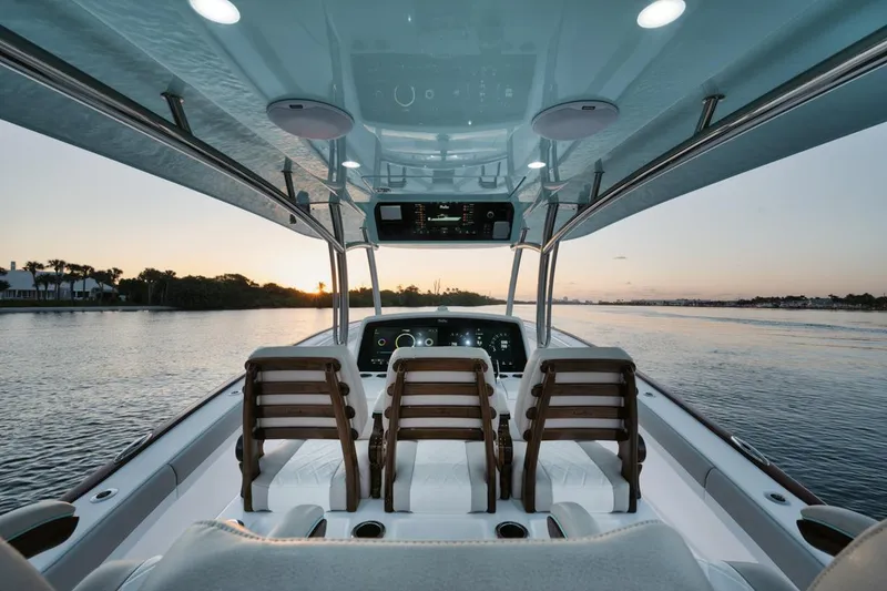 Slide: The Image of Interior view of 2025 Mag Bay 43 CC boat at sunset. - 15