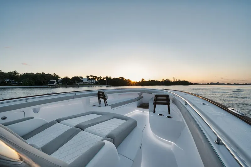 Slide: The Image of 2025 Mag Bay 43 CC boat at sunset on calm waters. - 22