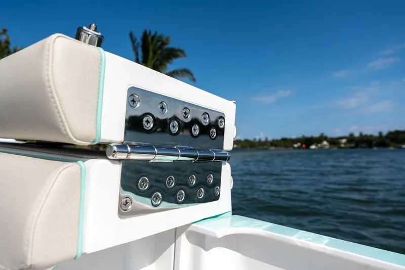 Slide: The Image of Close-up of 2025 Mag Bay 43 CC boat's stainless steel hardware and cushioned seating. - 31
