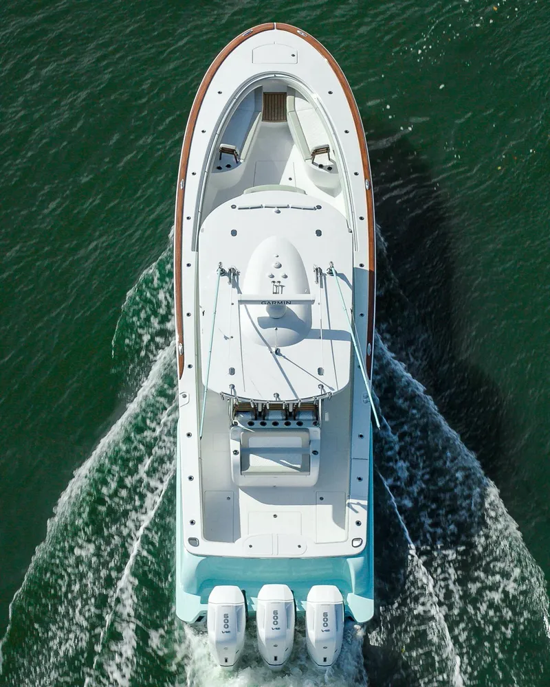 Slide: The Image of Aerial view of 2025 Mag Bay 43 CC boat cruising on water. - 6