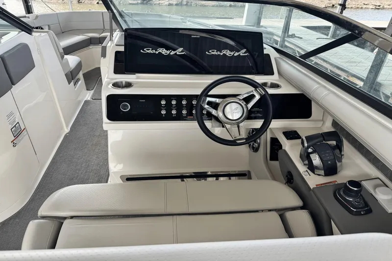 Slide: The Image of Interior of 2021 Sea Ray 310 SLX boat with modern helm and seating. - 12