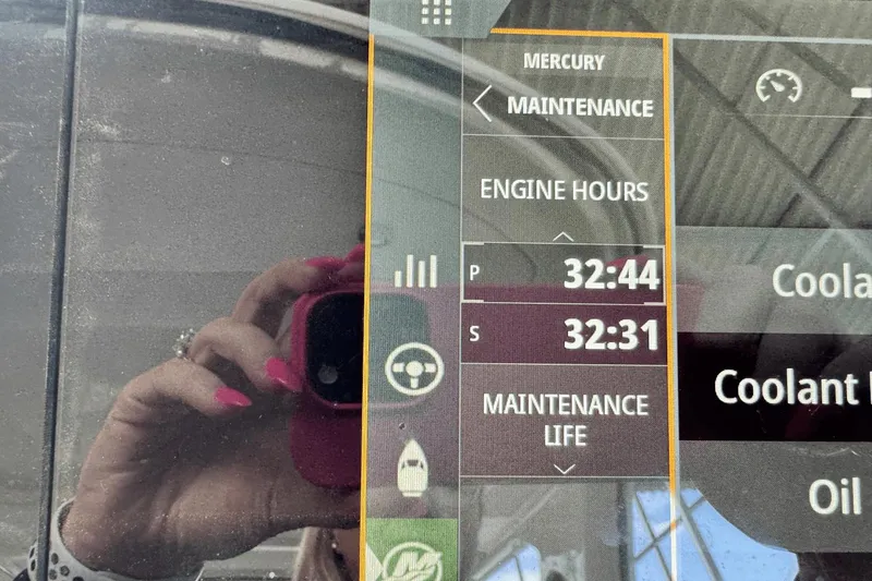 Slide: The Image of Display screen showing maintenance details of a 2021 Sea Ray 310 SLX boat. - 14