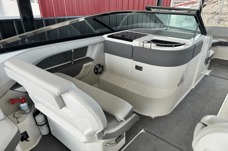 Slide: The Image of Interior of a 2021 Sea Ray 310 SLX boat with modern seating and sleek design. - 15