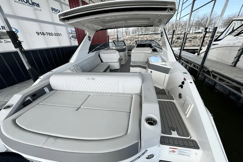Slide: The Image of 2021 Sea Ray 310 SLX luxury boat interior with spacious seating and modern design. - 16