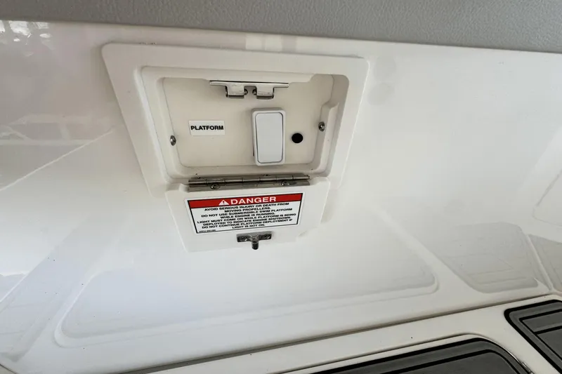 Slide: The Image of Control panel on a 2021 Sea Ray 310 SLX boat with safety warning label. - 17