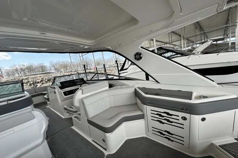 Slide: The Image of Interior of 2021 Sea Ray 310 SLX boat with luxurious seating and modern design. - 20