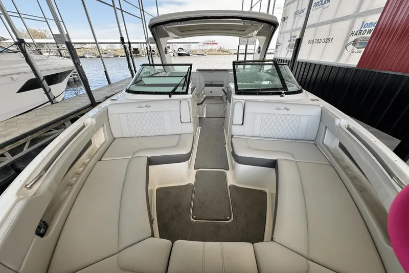 Slide: The Image of 2021 Sea Ray 310 SLX boat interior with spacious seating and modern design. - 22
