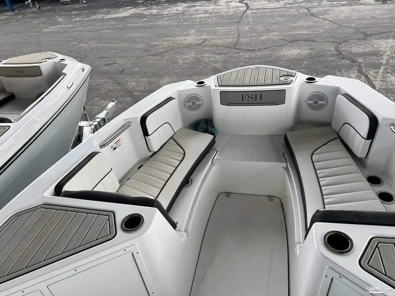 Slide: The Image of 2024 Yamaha Boats 222 FSH Sport interior seating and deck view. - 2