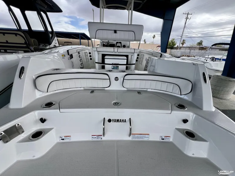 Slide: The Image of 2024 Yamaha Boats 222 FSH Sport interior view with seating and storage compartments. - 3