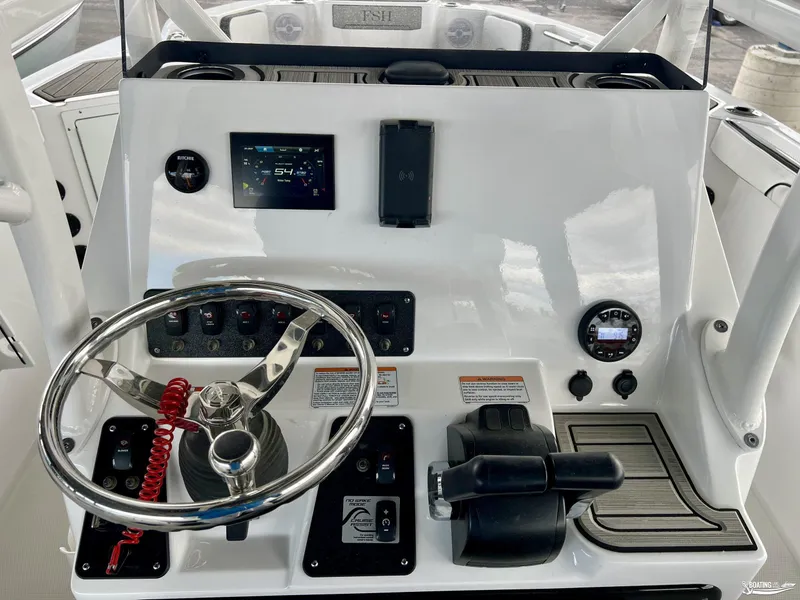 Slide: The Image of 2024 Yamaha Boats 222 FSH Sport dashboard with steering wheel and control panel. - 6