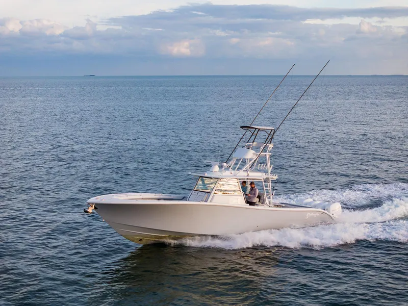 Slide: The Image of 2022 Yellowfin 42 boat cruising on open water. - 11
