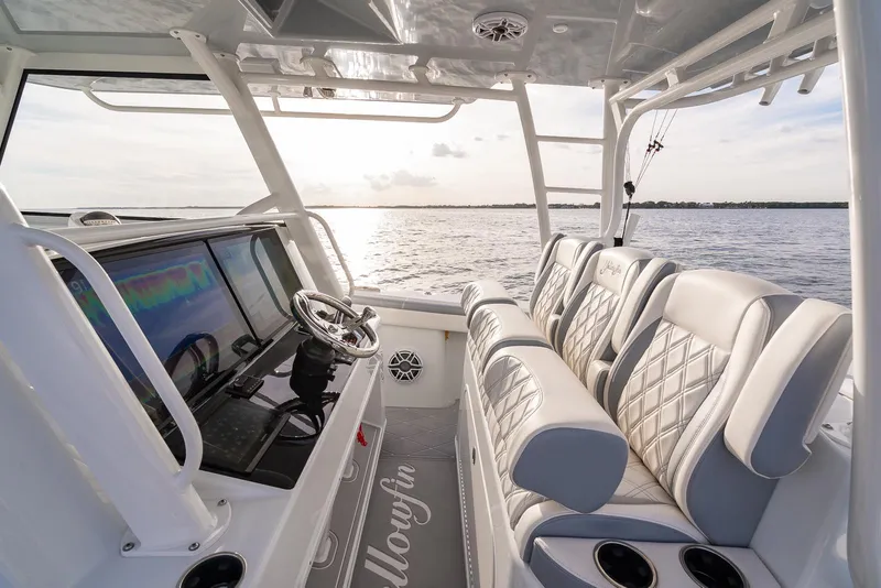 Slide: The Image of 2022 Yellowfin 42 boat interior with luxury seating and advanced navigation system. - 18