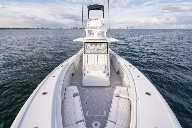 Slide: The Image of 2022 Yellowfin 42 boat on open water with spacious deck and seating. - 21