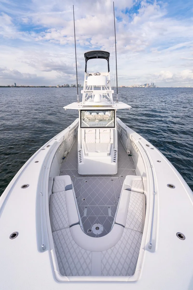 Slide: The Image of 2022 Yellowfin 42 boat on open water with spacious deck and seating. - 22