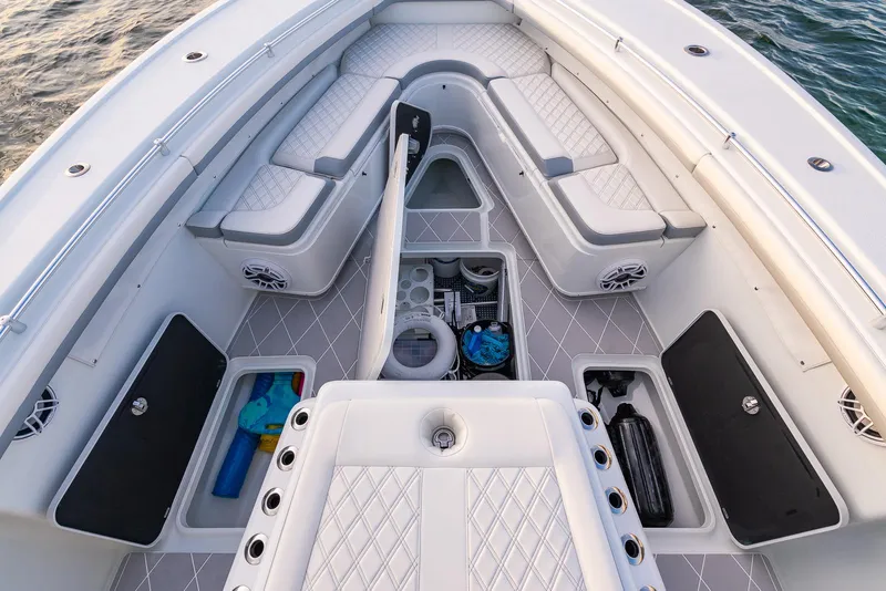 Slide: The Image of 2022 Yellowfin 42 boat interior with storage compartments and cushioned seating. - 32