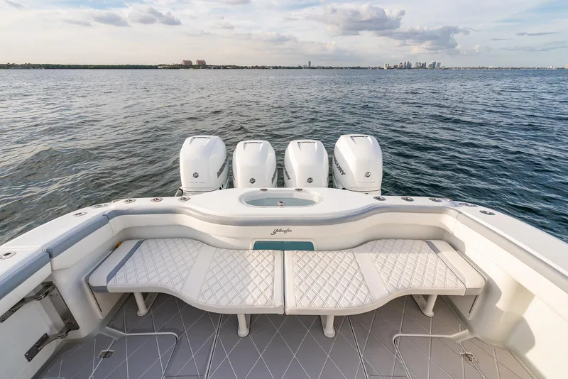 Slide: The Image of 2022 Yellowfin 42 boat with quad outboard engines on open water. - 37