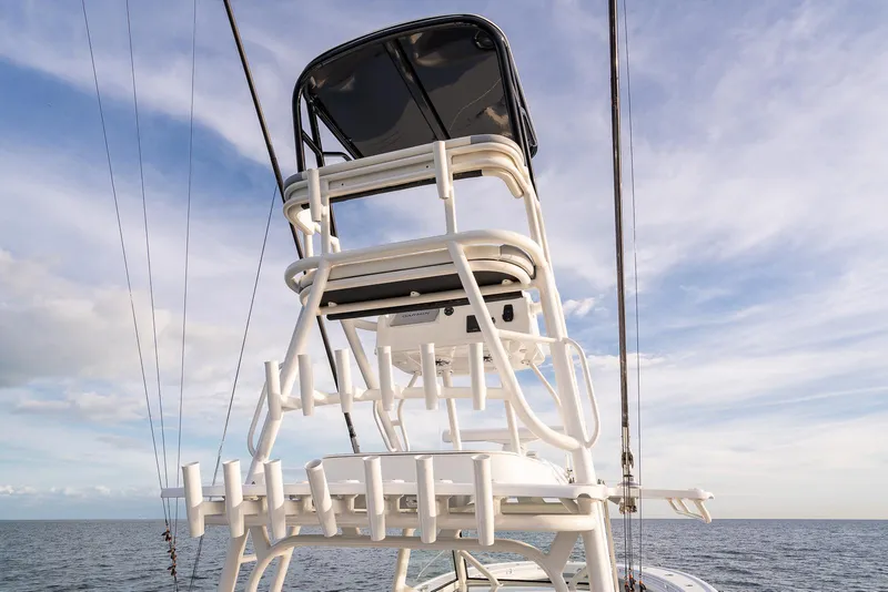 Slide: The Image of 2022 Yellowfin 42 boat tower with rod holders against a blue sky. - 43