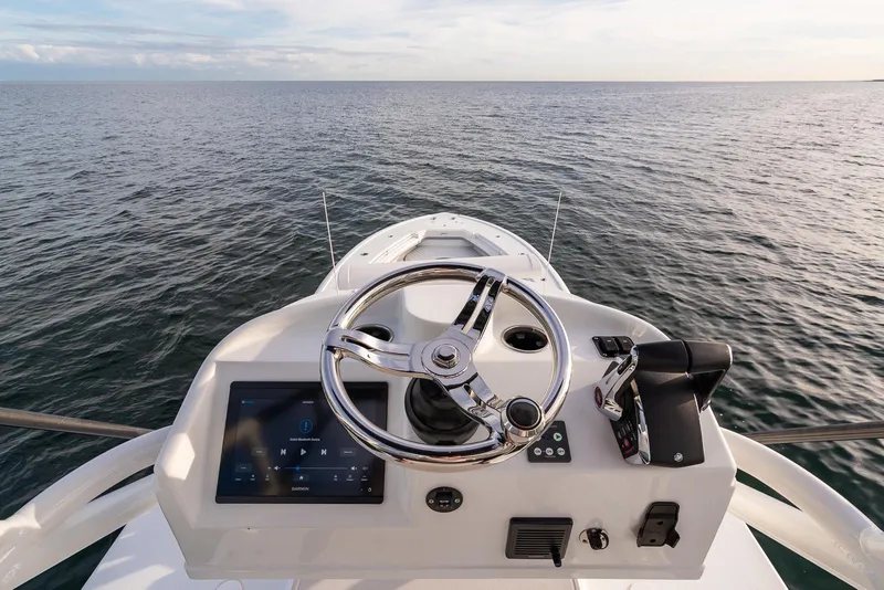 Slide: The Image of 2022 Yellowfin 42 boat helm with ocean view. - 44