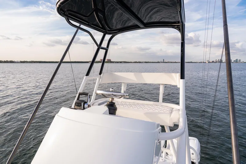 Slide: The Image of 2022 Yellowfin 42 boat helm station on calm waters. - 45