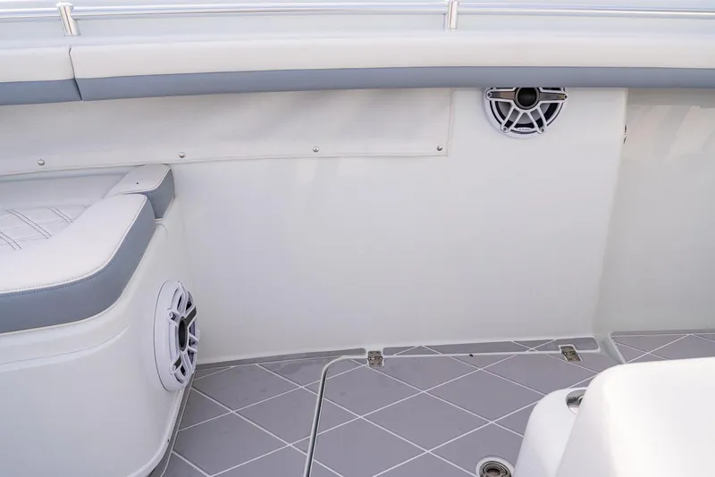 Slide: The Image of 2022 Yellowfin 42 boat interior with speakers and cushioned seating. - 46