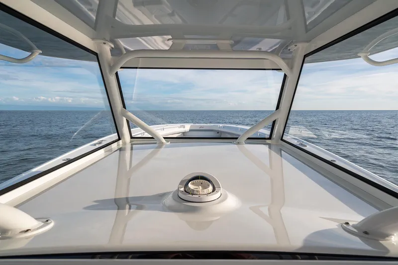 Slide: The Image of View from the helm of a 2022 Yellowfin 42 boat on open water. - 48