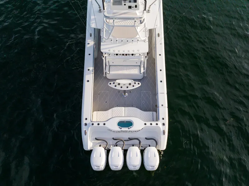 Slide: The Image of Aerial view of a 2022 Yellowfin 42 boat with four outboard engines. - 7